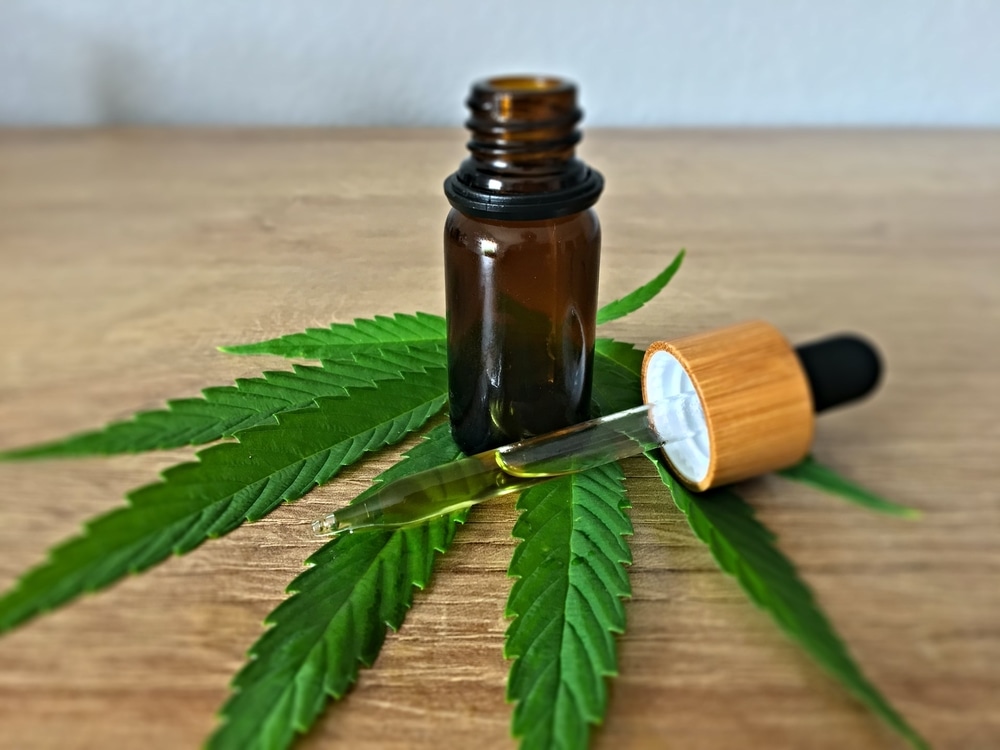 CBD oil with cannabis leaf